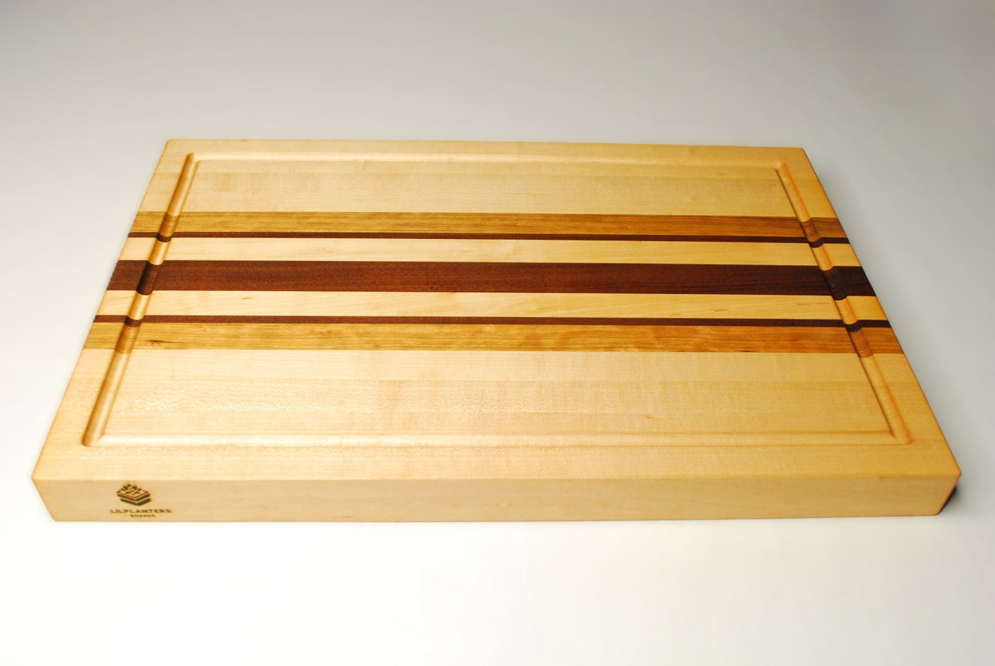 Wooden cutting board with striped pattern on a white background