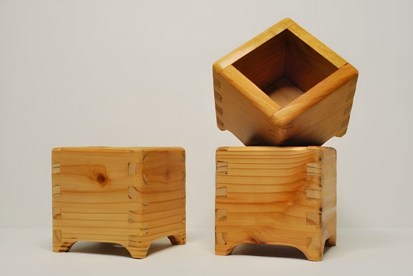 Handmade cubic cedar planter boxes – rustic wooden indoor/outdoor plant containers with finger joints, drainage holes, and eco-friendly natural finish. Perfect for herbs, succulents, or decorative storage.