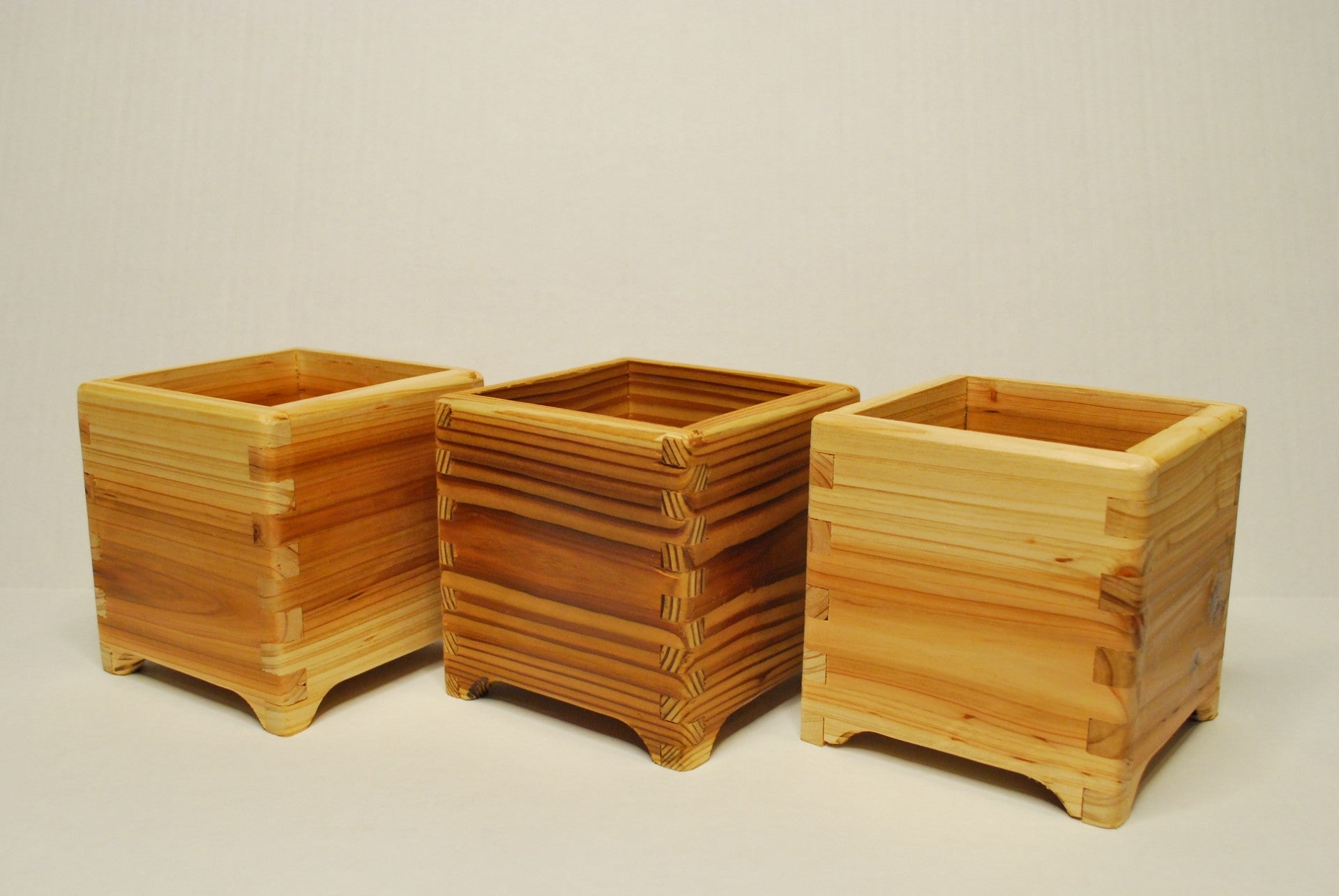 Handmade cubic cedar planter boxes – rustic wooden indoor/outdoor plant containers with finger joints, drainage holes, and eco-friendly natural finish. Perfect for herbs, succulents, or decorative storage.