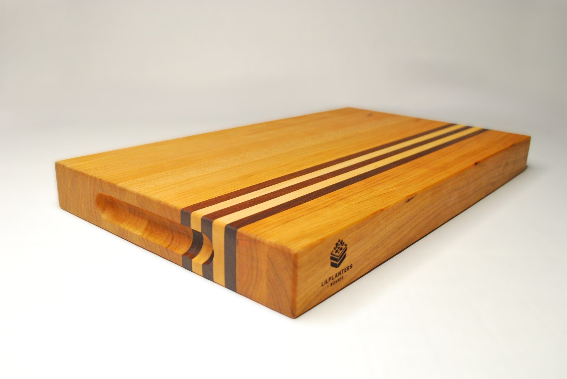 Wooden cutting board with a visible brand logo on a white background