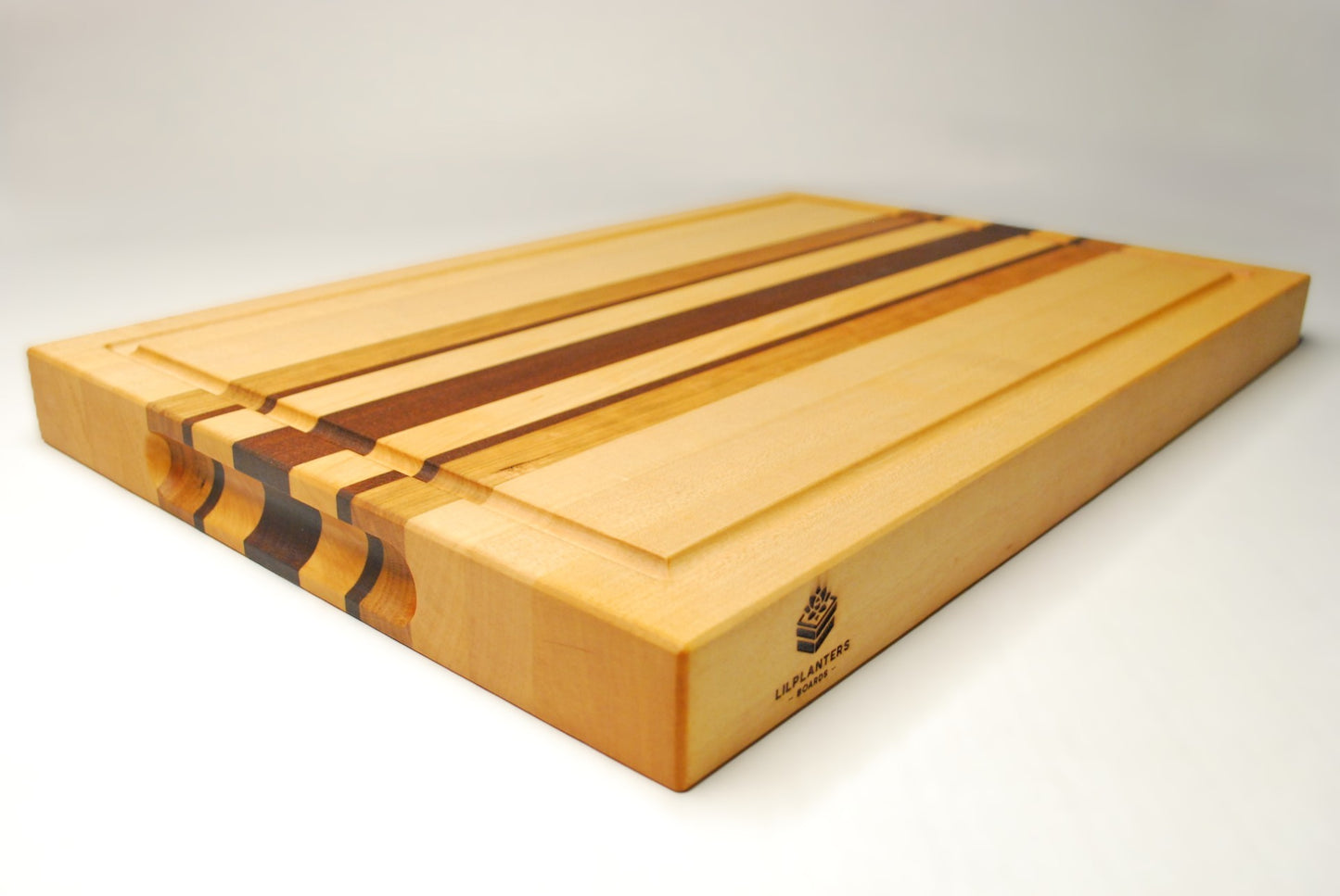Wooden cutting board with a visible brand logo on a white background