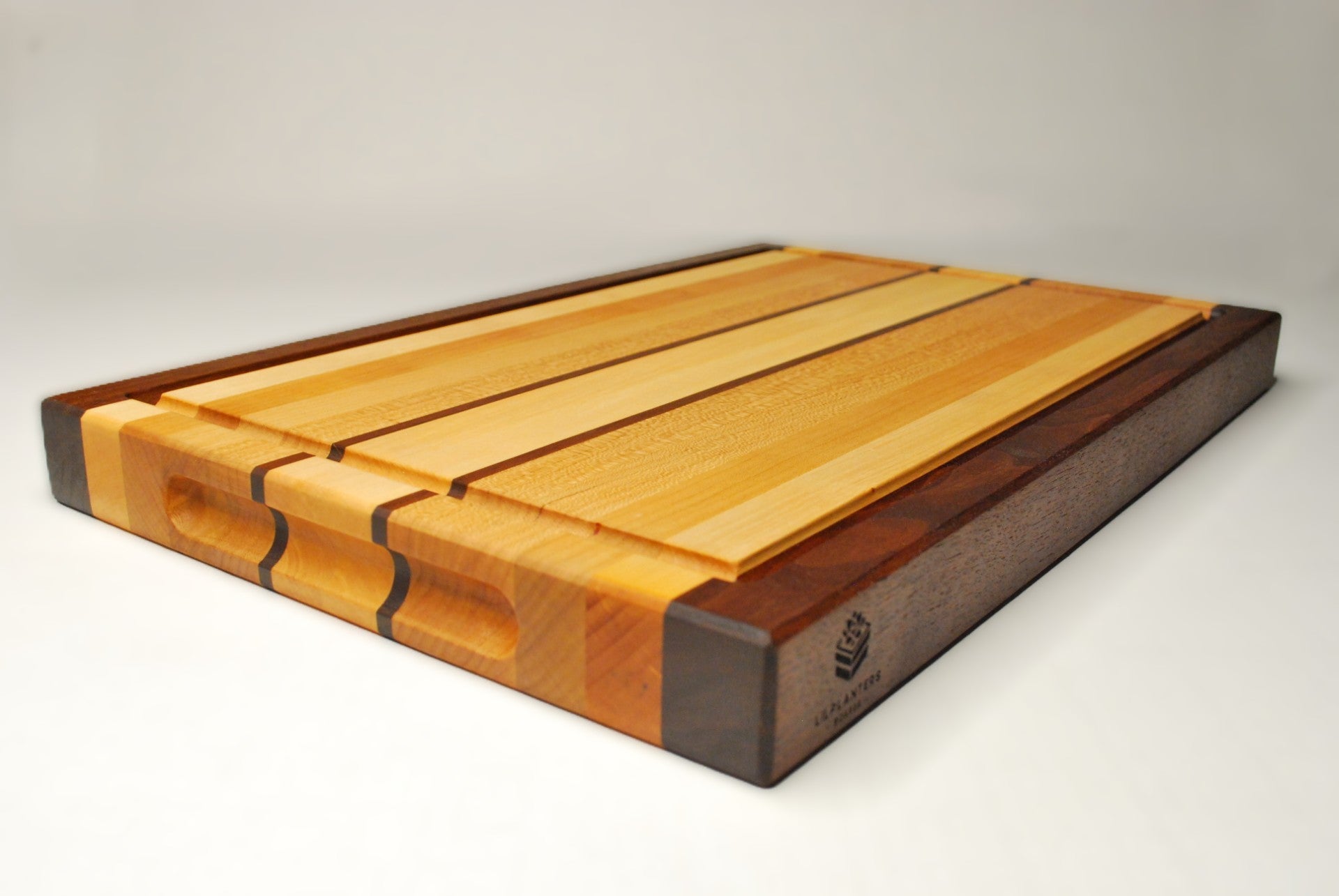 Wooden cutting board with a striped pattern on a white background